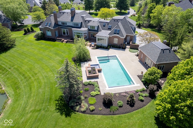 view from above of property with a pool area
