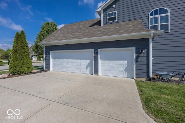garage featuring driveway