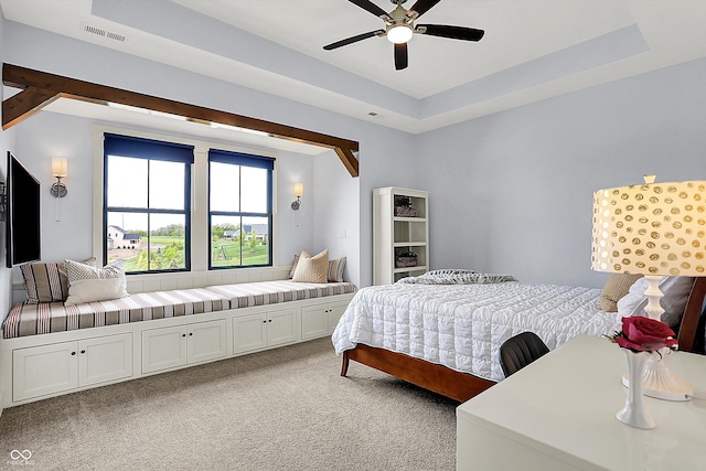 5120 Melbourne Pl, Zionsville, IN 46077 - bedroom featuring light colored carpet, a tray ceiling, and ceiling fan