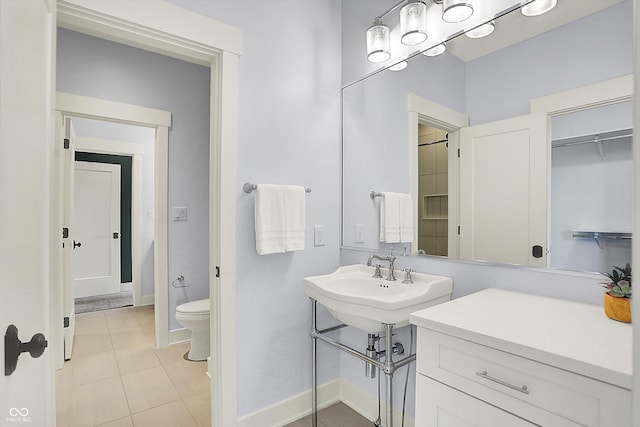 5120 Melbourne Pl, Zionsville, IN 46077 - bathroom featuring toilet, tile patterned floors, a sink, and baseboards