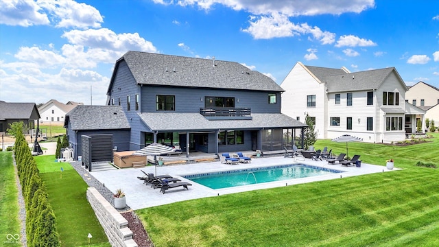 5120 Melbourne Pl, Zionsville, IN 46077 - rear view of house with a patio area, a yard, an outdoor pool, roof with shingles, and a residential view
