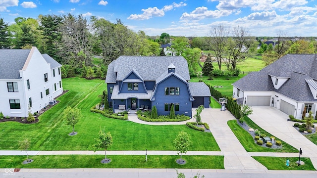 5120 Melbourne Pl, Zionsville, IN 46077 - view of front of home featuring a garage, concrete driveway, and a front lawn
