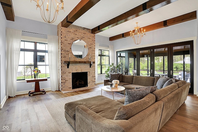 5120 Melbourne Pl, Zionsville, IN 46077 - living area featuring a chandelier, beamed ceiling, plenty of natural light, hardwood / wood-style flooring, and a high ceiling