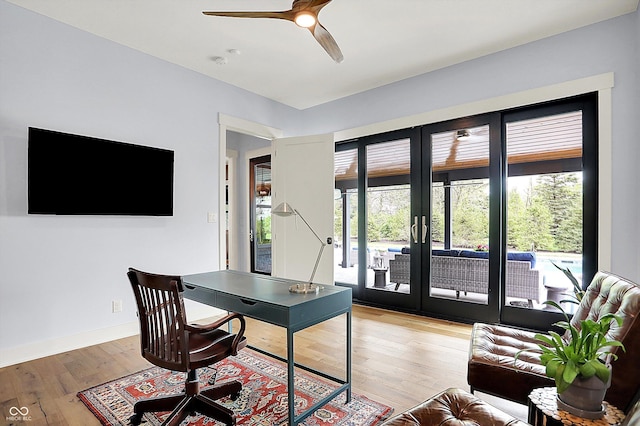 5120 Melbourne Pl, Zionsville, IN 46077 - office featuring french doors, light wood finished floors, ceiling fan, and baseboards