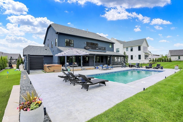 5120 Melbourne Pl, Zionsville, IN 46077 - outdoor pool featuring a hot tub, a patio, a lawn, and a sunroom