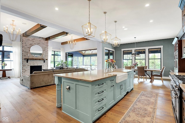 5120 Melbourne Pl, Zionsville, IN 46077 - kitchen with green cabinets, a chandelier, a sink, recessed lighting, and plenty of natural light