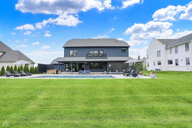 5120 Melbourne Pl, Zionsville, IN 46077 - back of property with a patio area, an outdoor pool, a lawn, and a shingled roof