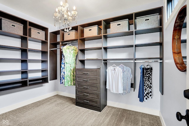 5120 Melbourne Pl, Zionsville, IN 46077 - walk in closet with carpet flooring and a chandelier