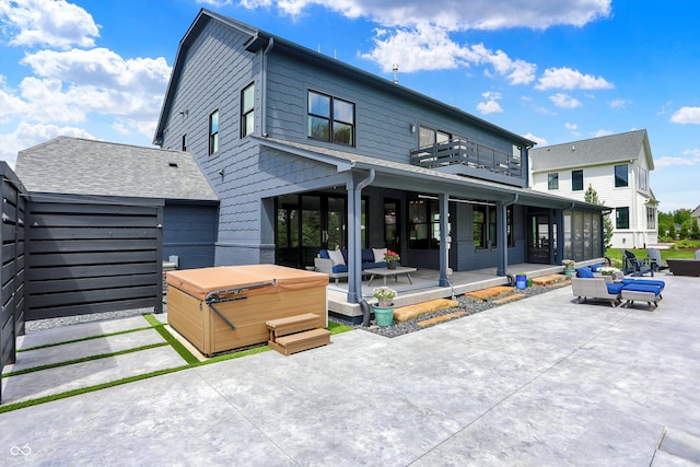 5120 Melbourne Pl, Zionsville, IN 46077 - rear view of property with a hot tub, a patio area, a balcony, and an outdoor hangout area