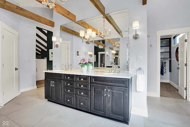 5120 Melbourne Pl, Zionsville, IN 46077 - bathroom with double vanity, a chandelier, baseboards, and tile patterned floors