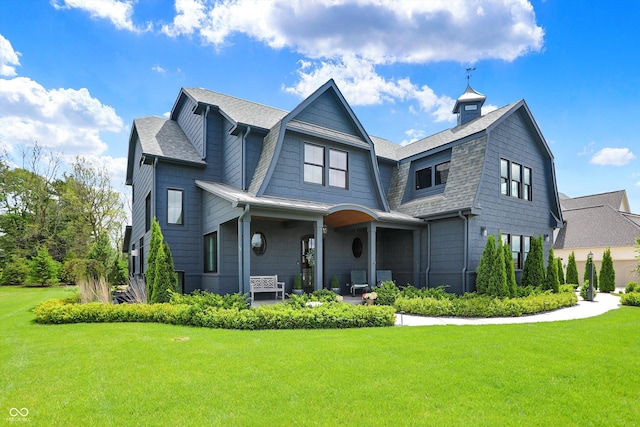 5120 Melbourne Pl, Zionsville, IN 46077 - rear view of property with a lawn, a gambrel roof, and a shingled roof
