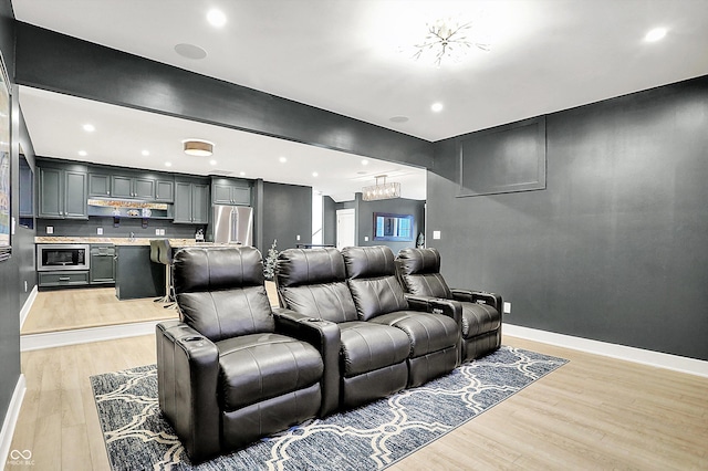 5120 Melbourne Pl, Zionsville, IN 46077 - cinema featuring light wood finished floors, baseboards, recessed lighting, and plenty of natural light