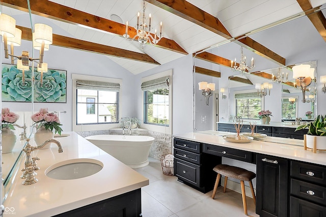 5120 Melbourne Pl, Zionsville, IN 46077 - bathroom featuring a chandelier, plenty of natural light, a soaking tub, two vanities, and wooden ceiling