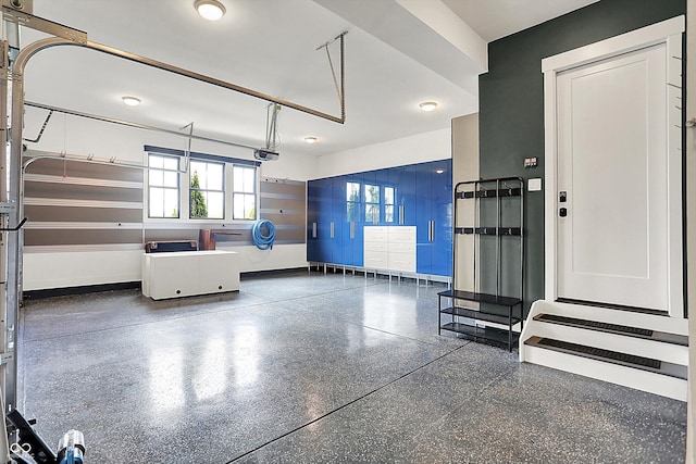 5120 Melbourne Pl, Zionsville, IN 46077 - garage with a garage door opener and baseboards