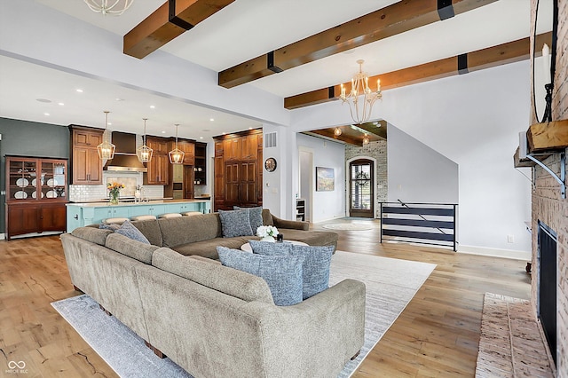 5120 Melbourne Pl, Zionsville, IN 46077 - living room with beamed ceiling, a chandelier, baseboards, light wood-style flooring, and recessed lighting
