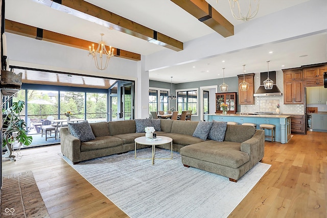 5120 Melbourne Pl, Zionsville, IN 46077 - living area featuring a chandelier, light wood-style floors, recessed lighting, and beamed ceiling