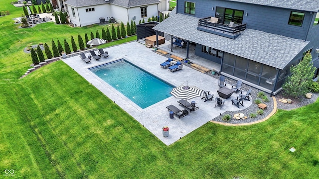 5120 Melbourne Pl, Zionsville, IN 46077 - swimming pool with an outdoor living space with a fire pit, outdoor dining area, a patio area, a lawn, and a sunroom