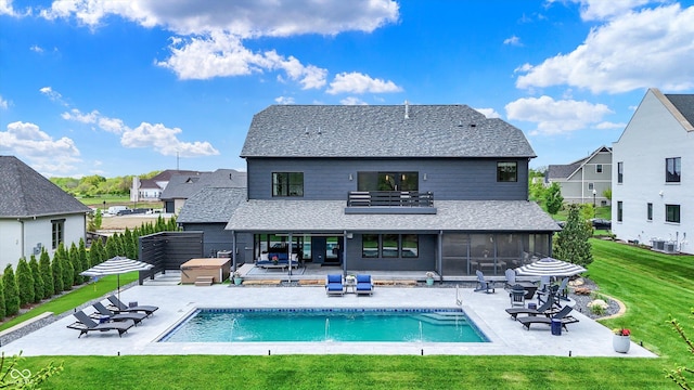 5120 Melbourne Pl, Zionsville, IN 46077 - back of property with a yard, a sunroom, a patio, and a shingled roof