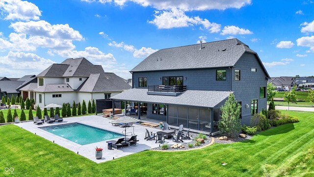 5120 Melbourne Pl, Zionsville, IN 46077 - back of property with a yard, a patio, outdoor dining space, a shingled roof, and a sunroom