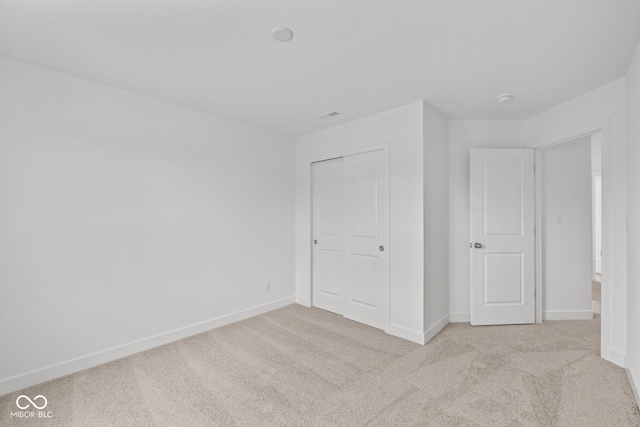 3913 Highcrest Rd, Indianapolis, IN 46239 - unfurnished bedroom featuring carpet flooring, baseboards, and a closet