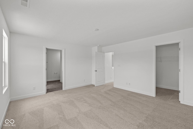 3913 Highcrest Rd, Indianapolis, IN 46239 - unfurnished bedroom with carpet, baseboards, a spacious closet, and a closet
