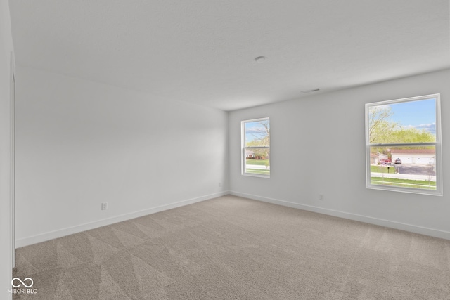 3913 Highcrest Rd, Indianapolis, IN 46239 - empty room featuring baseboards and carpet flooring