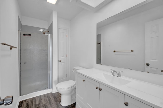 1847 Crystal Bay E Dr, Plainfield, IN 46168 - bathroom featuring vanity, toilet, wood finished floors, and a stall shower