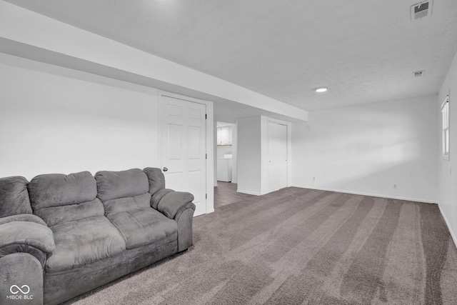 1847 Crystal Bay E Dr, Plainfield, IN 46168 - carpeted living room featuring visible vents, baseboards, and a textured ceiling