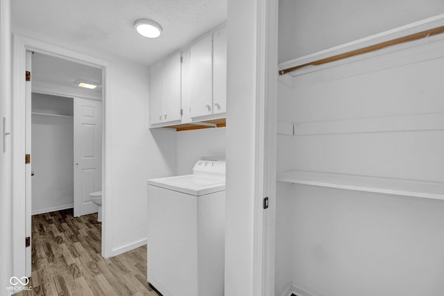 1847 Crystal Bay E Dr, Plainfield, IN 46168 - clothes washing area featuring baseboards, light wood-type flooring, washer / dryer, cabinet space, and a textured ceiling