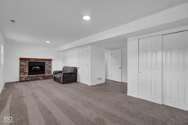 1847 Crystal Bay E Dr, Plainfield, IN 46168 - interior space with visible vents, carpet, a brick fireplace, and a textured ceiling