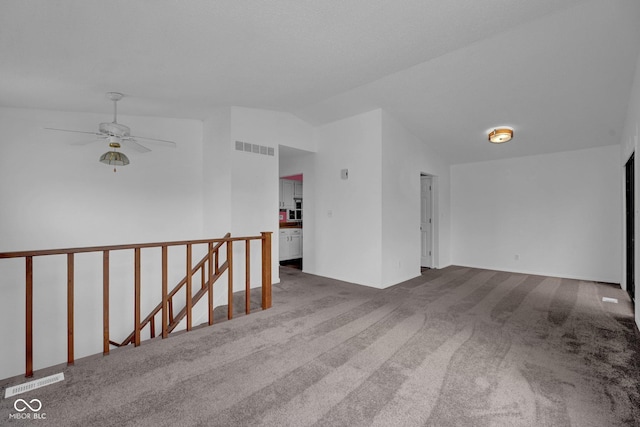 1847 Crystal Bay E Dr, Plainfield, IN 46168 - carpeted empty room with lofted ceiling, a ceiling fan, and visible vents
