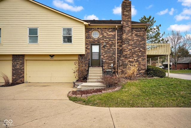 1847 Crystal Bay E Dr, Plainfield, IN 46168 - bi-level home with driveway, a front yard, a garage, brick siding, and a chimney