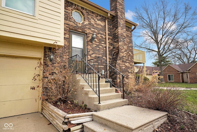 1847 Crystal Bay E Dr, Plainfield, IN 46168 - view of exterior entry featuring brick siding and a chimney