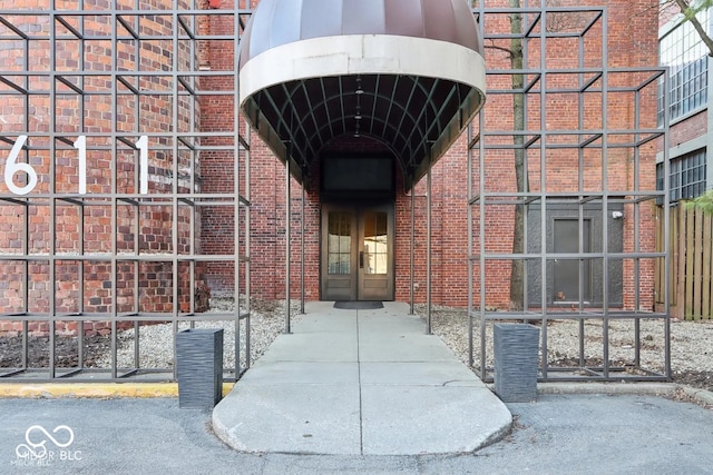 property entrance with brick siding