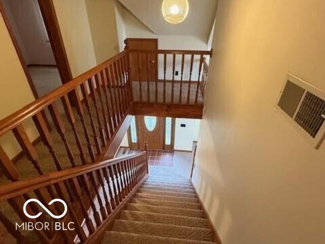 1 Vaught Rd, Hartford City, IN 47348 - staircase featuring carpet flooring and visible vents