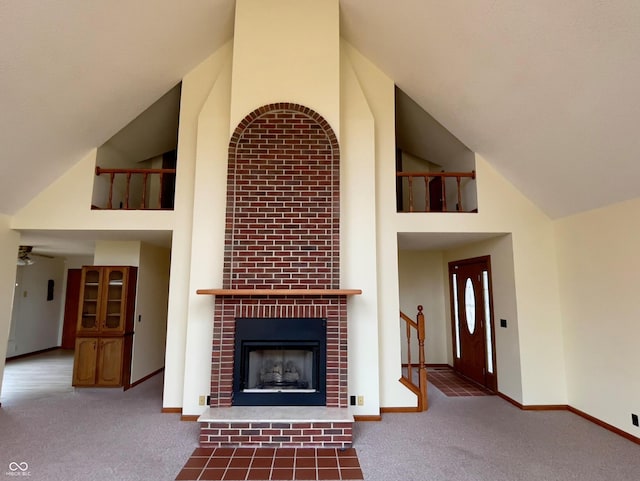 1 Vaught Rd, Hartford City, IN 47348 - unfurnished living room featuring high vaulted ceiling, baseboards, and carpet