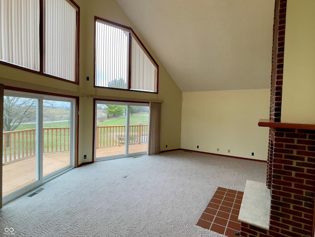 1 Vaught Rd, Hartford City, IN 47348 - unfurnished living room with plenty of natural light, visible vents, carpet, and high vaulted ceiling