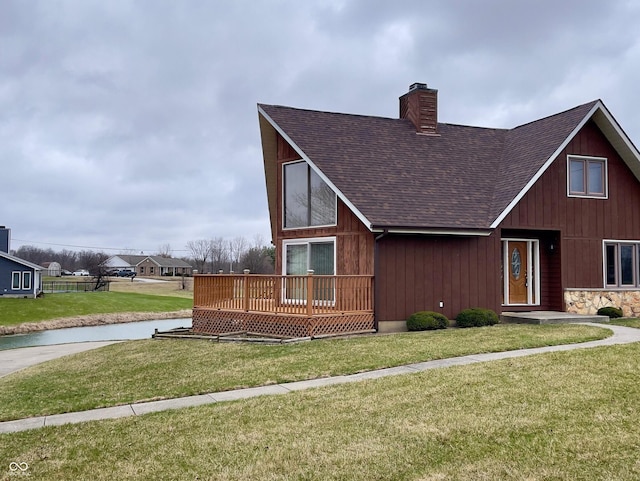 1 Vaught Rd, Hartford City, IN 47348 - view of front of property with a chimney, roof with shingles, and a front yard