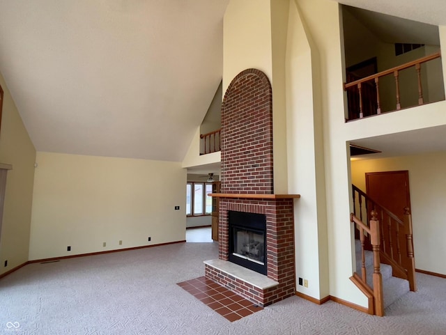 1 Vaught Rd, Hartford City, IN 47348 - unfurnished living room featuring a brick fireplace, carpet flooring, high vaulted ceiling, and stairs