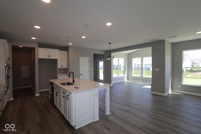 10609 Banyan Wood Ct, Indianapolis, IN 46239 - kitchen featuring a sink, white cabinetry, recessed lighting, baseboards, and open floor plan