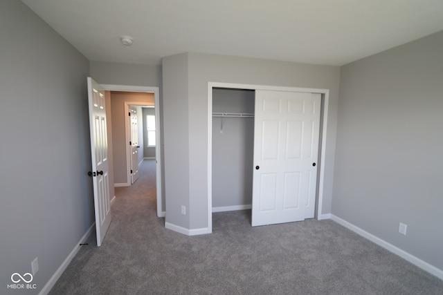 10609 Banyan Wood Ct, Indianapolis, IN 46239 - unfurnished bedroom featuring carpet floors, baseboards, and a closet