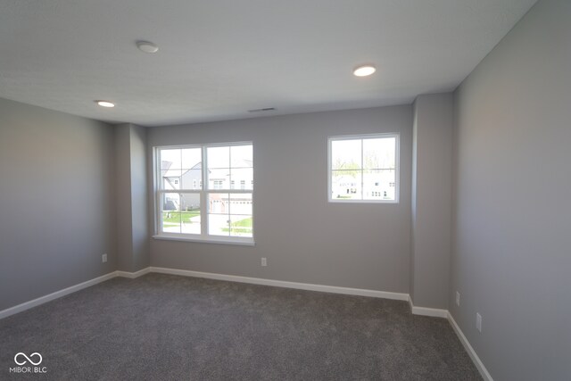 10609 Banyan Wood Ct, Indianapolis, IN 46239 - unfurnished room featuring dark carpet, baseboards, and recessed lighting