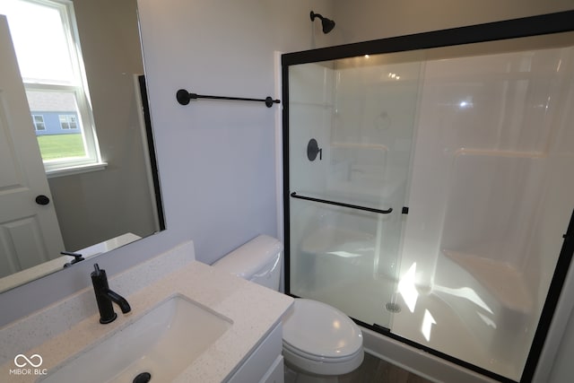 10609 Banyan Wood Ct, Indianapolis, IN 46239 - bathroom featuring a shower stall, toilet, and vanity