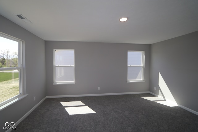 10609 Banyan Wood Ct, Indianapolis, IN 46239 - unfurnished room featuring dark carpet, baseboards, and recessed lighting