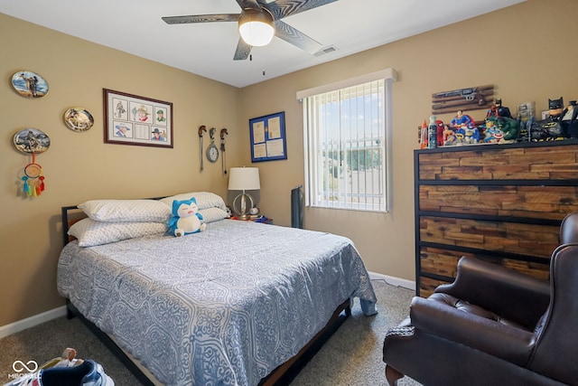 carpeted bedroom featuring visible vents, baseboards, and ceiling fan