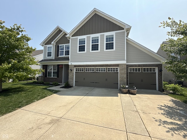 6345 Meadowview Dr, Whitestown, IN 46075 - view of front of home featuring board and batten siding, concrete driveway, a front lawn, a garage, and central AC