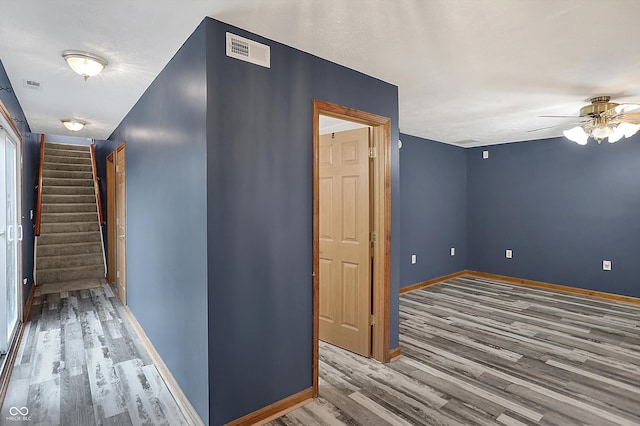 5371 Lue Ann Ln, Mooresville, IN 46158 - hallway with baseboards, stairs, visible vents, and wood finished floors