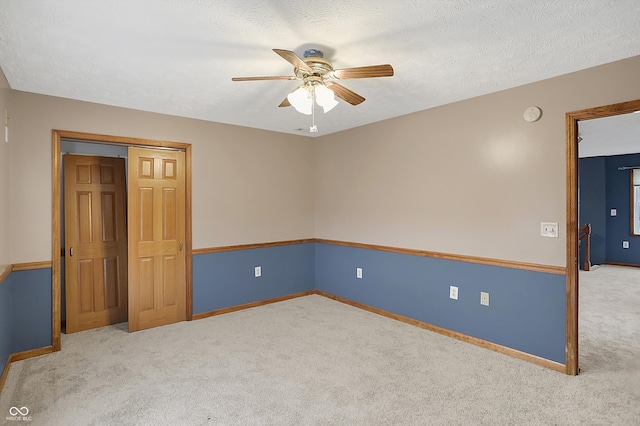 5371 Lue Ann Ln, Mooresville, IN 46158 - spare room with a ceiling fan, carpet floors, baseboards, and a textured ceiling