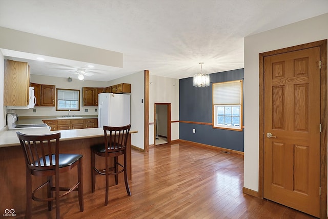 5371 Lue Ann Ln, Mooresville, IN 46158 - kitchen featuring light countertops, wood finished floors, baseboards, and white appliances