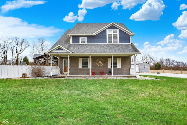 5371 Lue Ann Ln, Mooresville, IN 46158 - view of front facade with roof with shingles, fence, a front yard, brick siding, and a porch